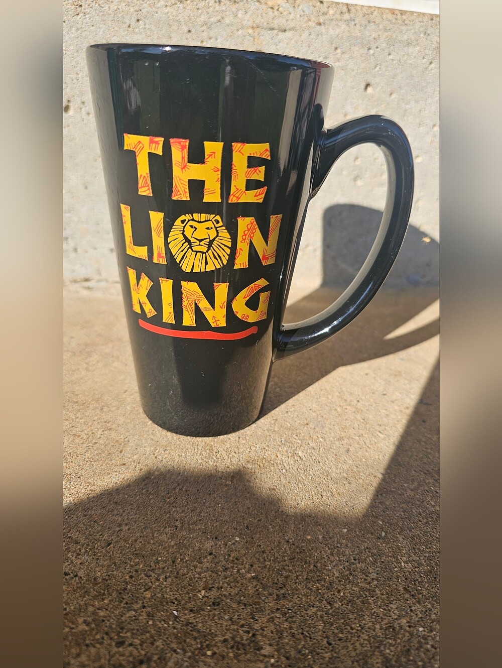 The Lion King Tall Black Ceramic Mug with Yellow & Red Design